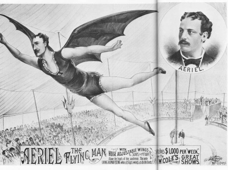 a man flying in the air with a bat wings