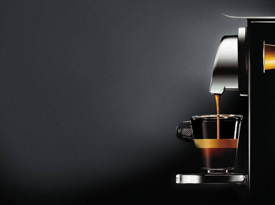 a coffee machine pouring a coffee into a cup